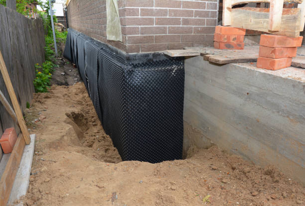 Happy homeowners after waterproofing job in Lincroft